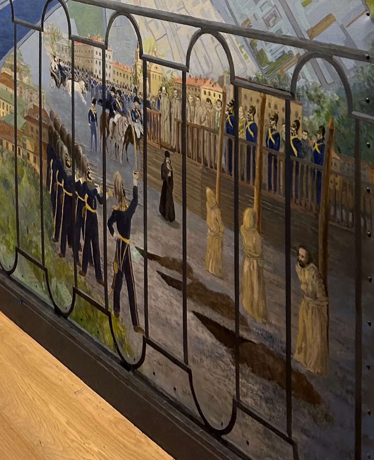 Dostoevsky and other members of the anti-Czarist Petrashevsky Circle in St. Petersburg were imprisoned and then subjected to a mock execution. This horrifying experience echoes in Crime and Punishment. An interpretation of B. Pokrovsky’s drawing of this event anchors the lower right corner of the mural